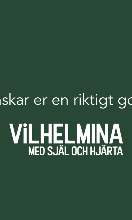 Ett kort med grön bakgrund och texten Vi önskar er en riktigt god jul. Vilhelmina, med själ och hjärta